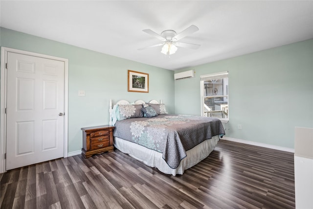 bedroom featuring baseboards, a wall mounted air conditioner, a ceiling fan, and wood finished floors