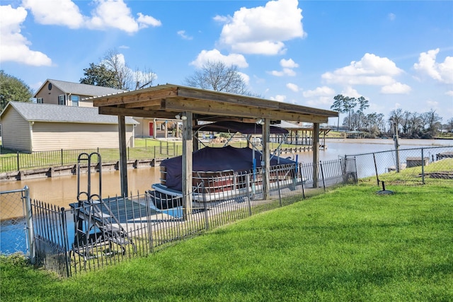 exterior space featuring boat lift, fence, a floating dock, a yard, and a water view