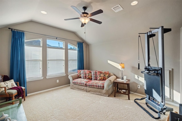 living area with lofted ceiling, carpet floors, and visible vents