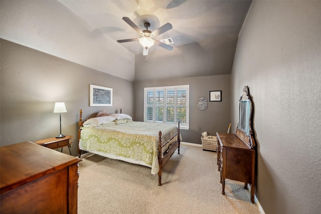 bedroom with visible vents, a ceiling fan, light carpet, vaulted ceiling, and baseboards