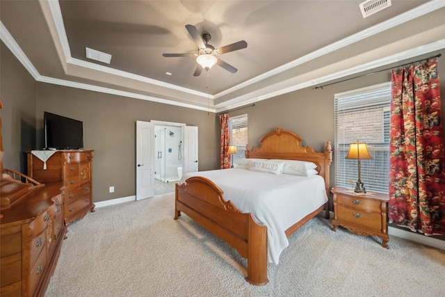 bedroom with carpet, a raised ceiling, visible vents, and crown molding