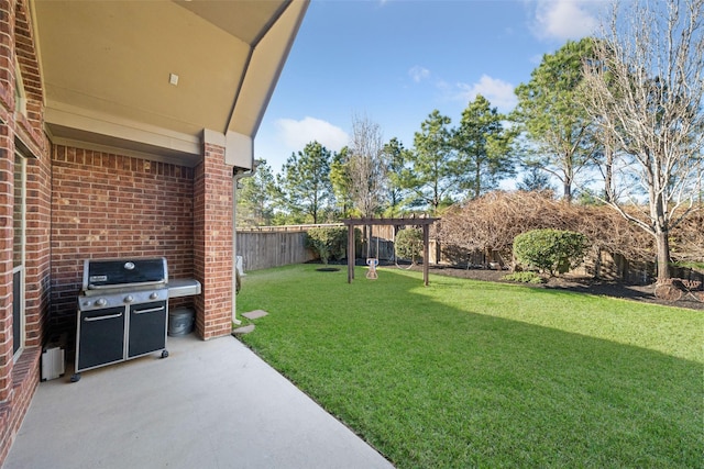 view of yard featuring a patio area, fence, and a pergola