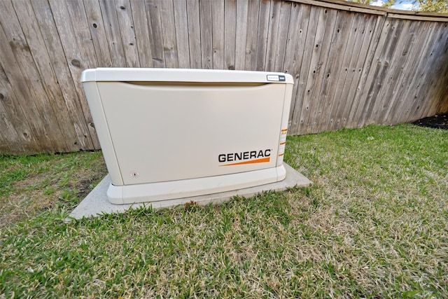 details featuring fence and a power unit