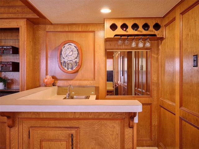 bathroom with a sink and a textured ceiling