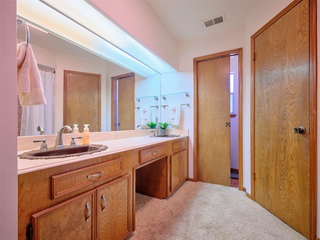 full bathroom featuring a sink, visible vents, and double vanity