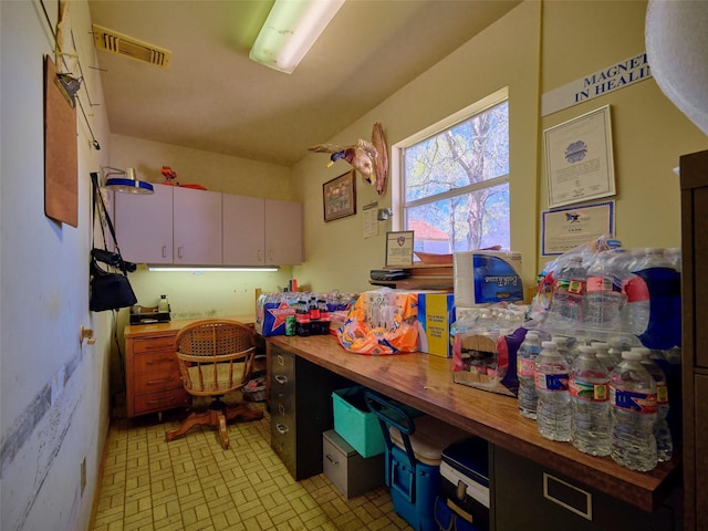 kitchen with visible vents and wooden counters