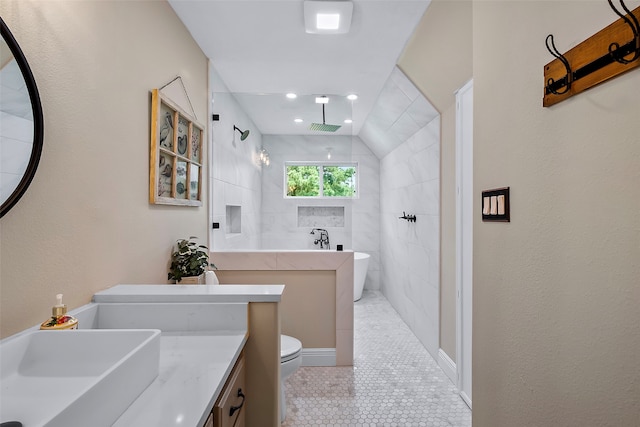 full bathroom with visible vents, tiled shower, toilet, a soaking tub, and vanity