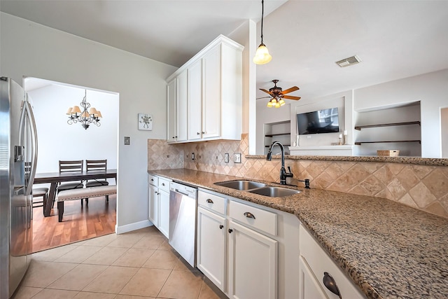 kitchen with light tile patterned floors, visible vents, appliances with stainless steel finishes, white cabinetry, and a sink