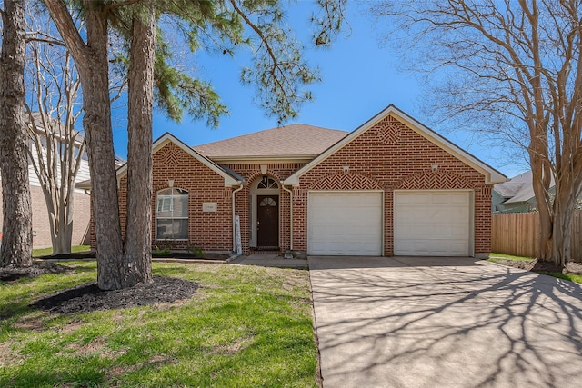 view of front of house with brick siding, concrete driveway, an attached garage, a front yard, and fence