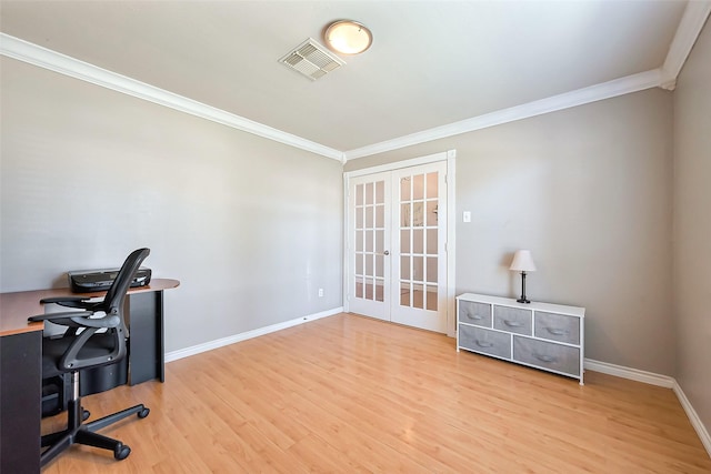 home office featuring crown molding, visible vents, wood finished floors, and french doors