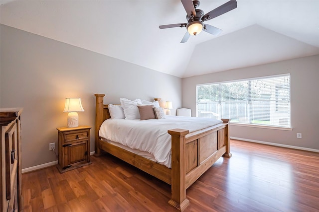 bedroom featuring lofted ceiling, ceiling fan, baseboards, and wood finished floors