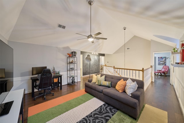 living area with hardwood / wood-style flooring, ceiling fan, visible vents, and vaulted ceiling