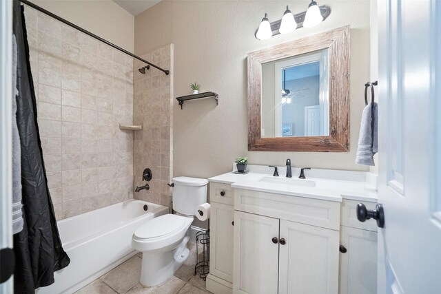 bathroom featuring shower / bathtub combination with curtain, toilet, vanity, and tile patterned flooring