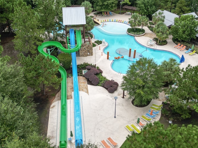 view of pool featuring playground community