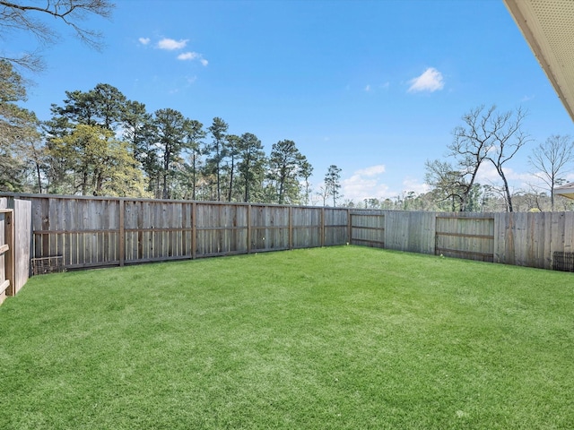 view of yard featuring a fenced backyard