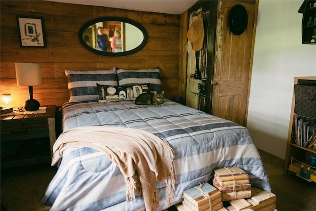 bedroom with wooden walls