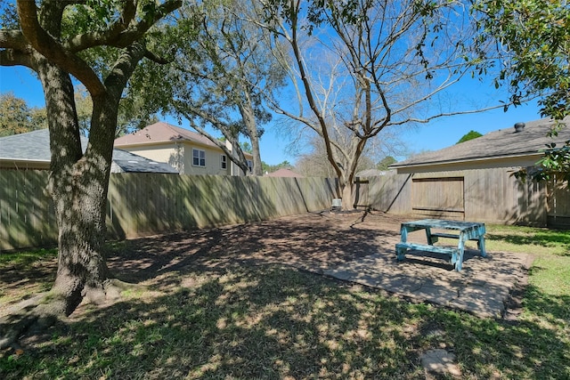 view of yard with a patio and a fenced backyard