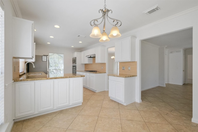 kitchen featuring visible vents, crown molding, appliances with stainless steel finishes, a notable chandelier, and white cabinetry