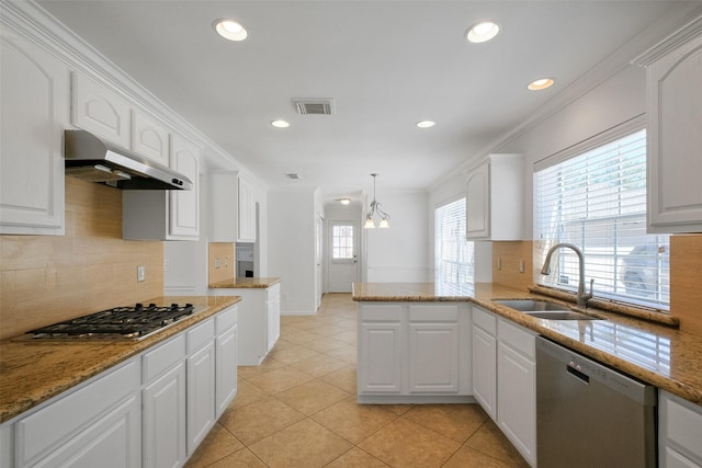 kitchen with ornamental molding, under cabinet range hood, a sink, stainless steel appliances, and white cabinets