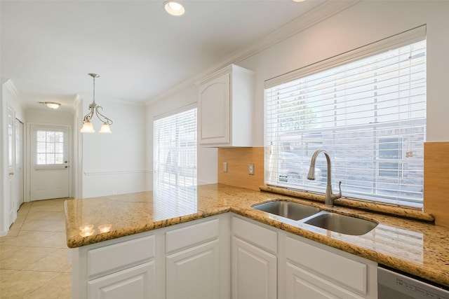 kitchen featuring a peninsula, ornamental molding, a sink, white cabinets, and dishwasher