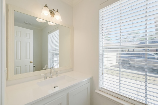 bathroom with vanity and visible vents