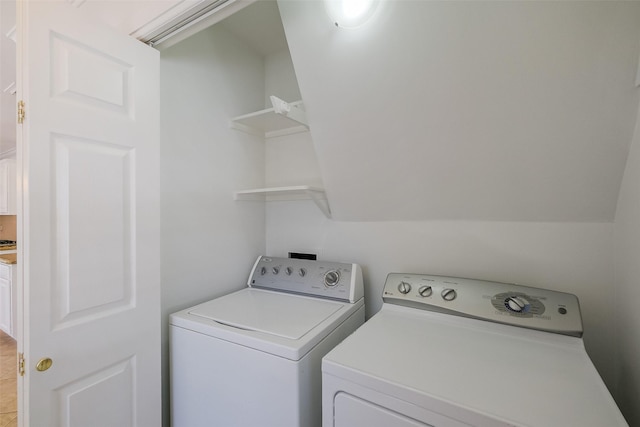 laundry room with separate washer and dryer and laundry area