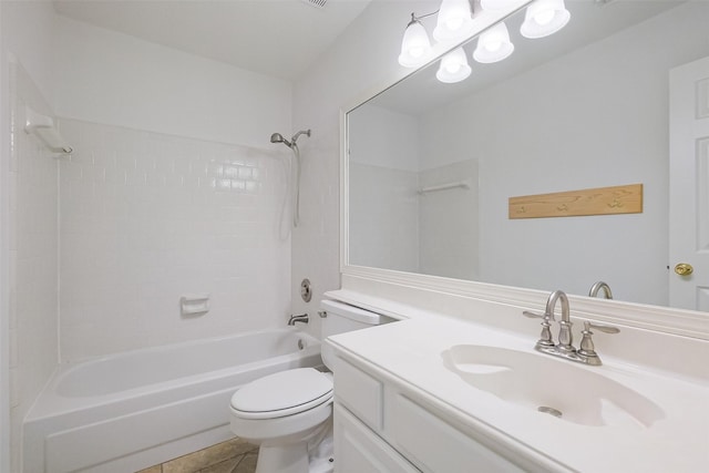 full bath featuring tile patterned floors, toilet, vanity, and  shower combination