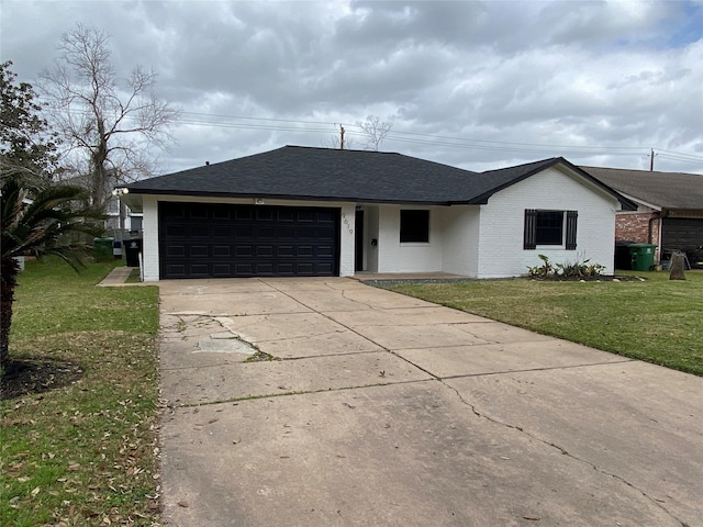 ranch-style house with driveway, a garage, roof with shingles, a front lawn, and brick siding