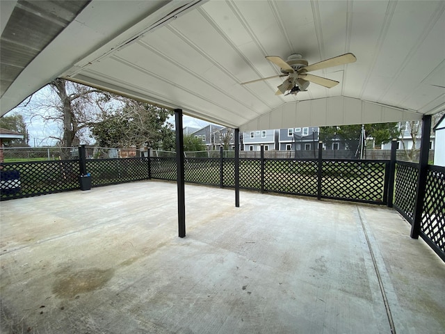 view of patio with fence and a ceiling fan