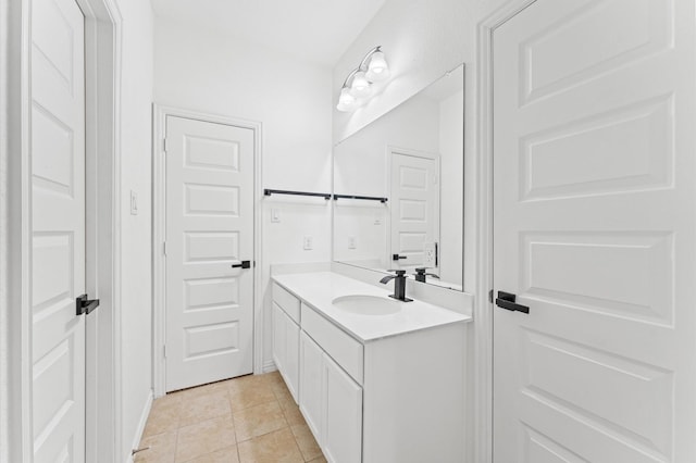 bathroom with tile patterned flooring and vanity