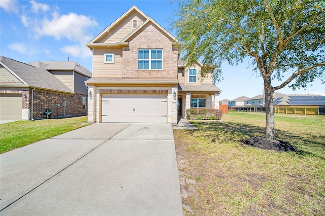 craftsman house featuring an attached garage, a front lawn, concrete driveway, and brick siding