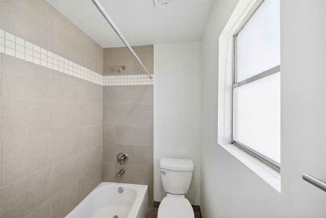 bathroom featuring toilet and shower / tub combination