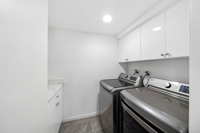 washroom with recessed lighting, cabinet space, baseboards, and separate washer and dryer