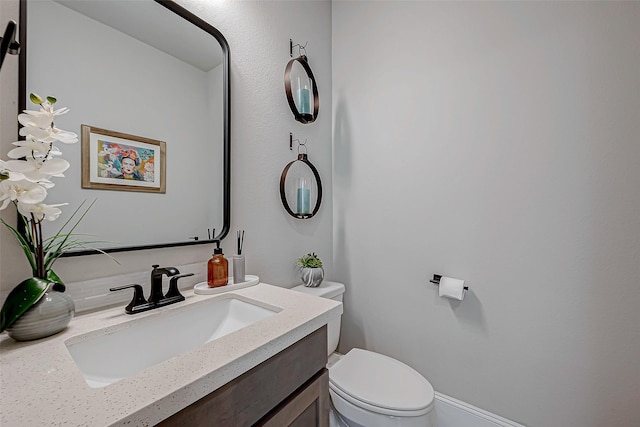 half bath with vanity and toilet