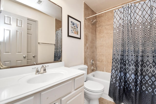 bathroom with toilet, visible vents, shower / bath combo with shower curtain, and vanity