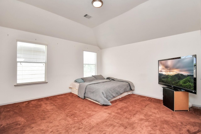 carpeted bedroom featuring baseboards, visible vents, and vaulted ceiling