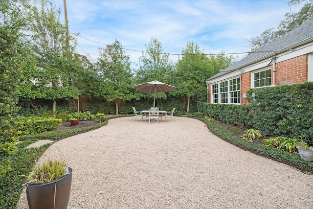 view of patio featuring fence