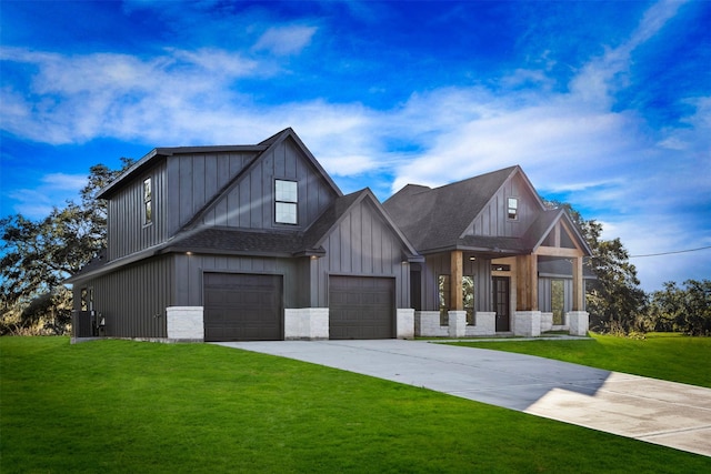 modern inspired farmhouse featuring a front yard, driveway, an attached garage, and central air condition unit