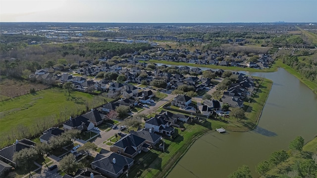 birds eye view of property featuring a water view and a residential view