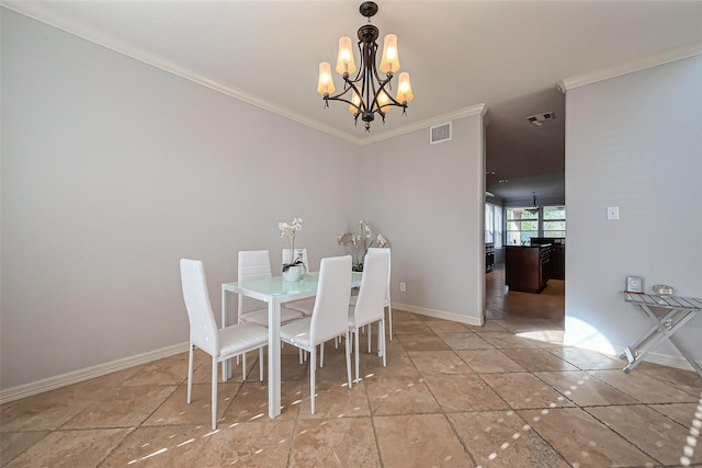 dining space with a chandelier, ornamental molding, visible vents, and baseboards