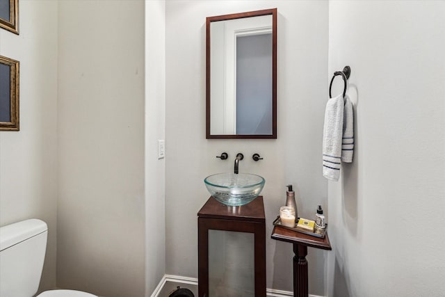 bathroom with a sink and toilet