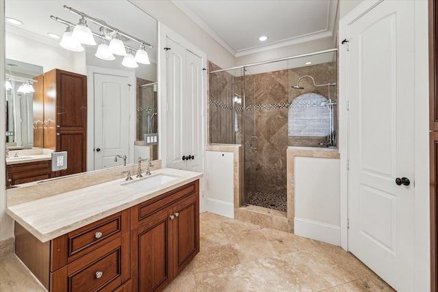 bathroom featuring a stall shower, crown molding, and vanity