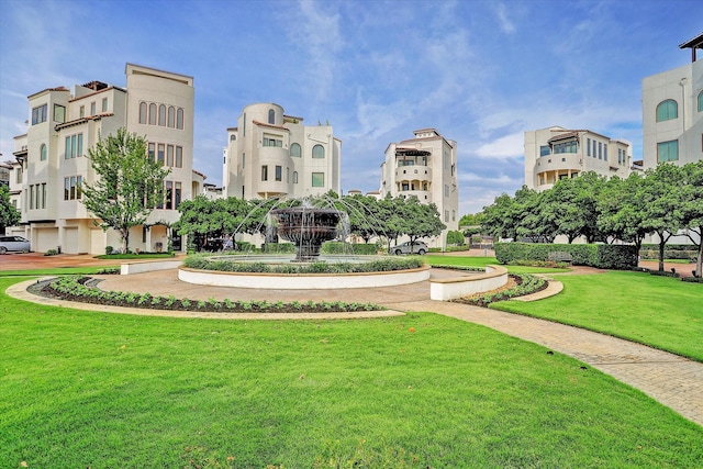 view of property's community featuring a lawn