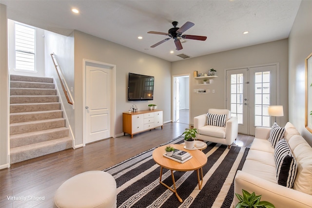 living area featuring visible vents, stairway, dark wood-type flooring, french doors, and recessed lighting