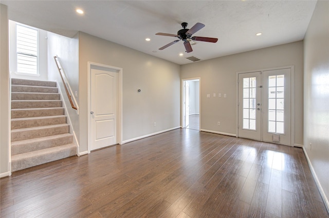 unfurnished living room featuring recessed lighting, visible vents, stairs, french doors, and dark wood finished floors