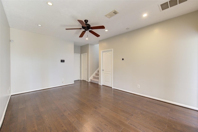 unfurnished room with a ceiling fan, recessed lighting, dark wood-style flooring, and visible vents