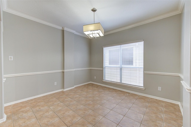 unfurnished room with light tile patterned floors, baseboards, and ornamental molding