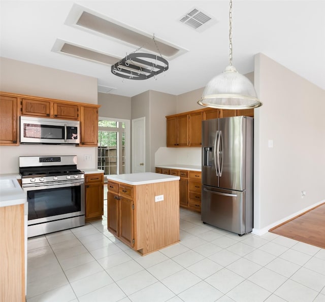 kitchen featuring light countertops, visible vents, appliances with stainless steel finishes, and a center island