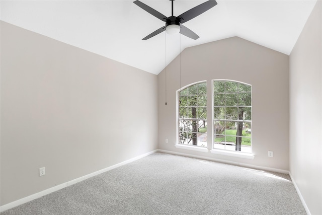 empty room with baseboards, a ceiling fan, lofted ceiling, and carpet floors