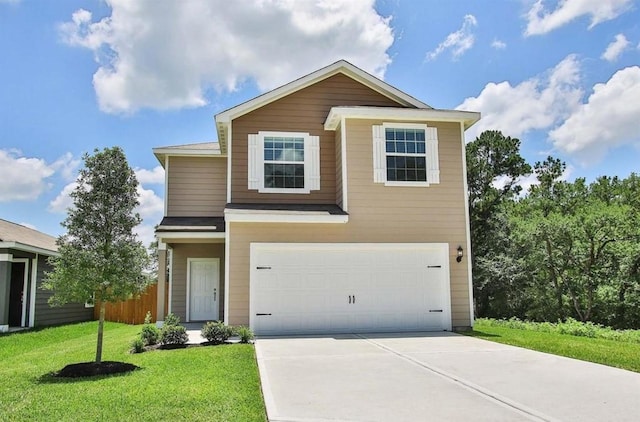 traditional-style home with concrete driveway, a garage, and a front yard